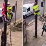 'Madness' as man on street attacks worker removing flag