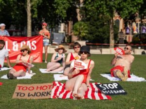 Read more about the article ‘Sunbathers’ protest new oil outside Parliament amidst heatwave